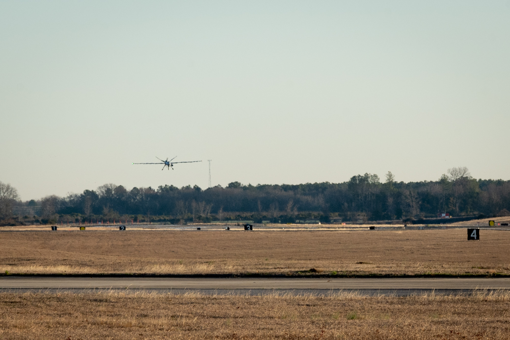 A U.S. Air Force MQ-9 Reaper assigned to March Air Reserve Base, Calif., piloted by members of the 25th Attack Group assigned to Shaw Air Force Base (AFB), S.C., lands at Shaw AFB, Feb. 14, 2024. This operation demonstrated innovative maintenance advancements and showcased the 25th Attack Group’s Satellite Launch and Recovery capabilities while successfully landing for the first time at Shaw AFB. (U.S. Air Force photo by Airman 1st Class Kyrii Richardson)