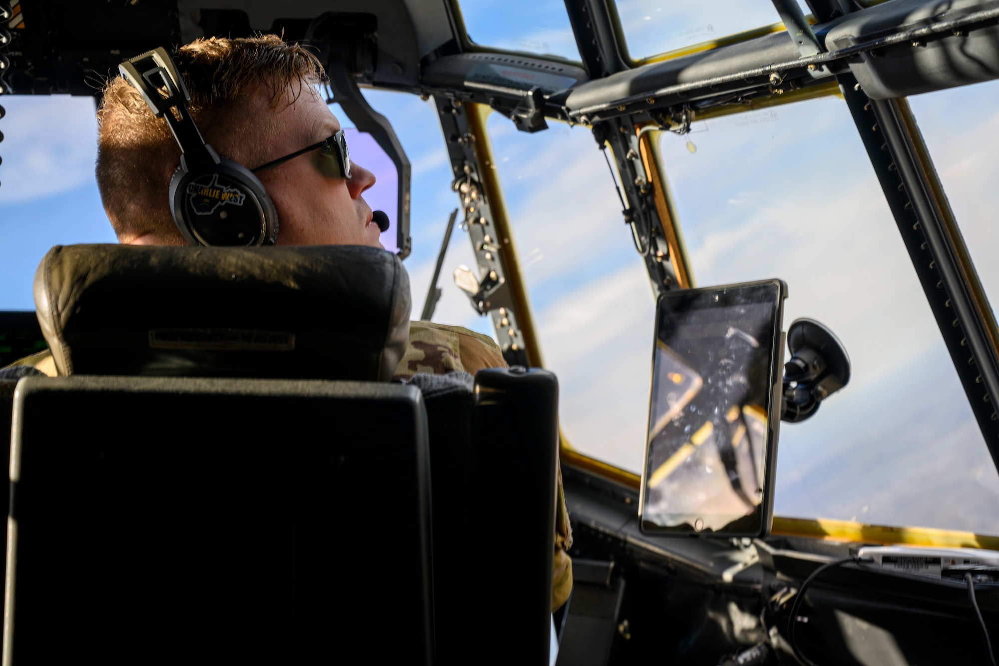 U.S. Air Force 1st Lt. Evin Hamm, a pilot assigned to the 130th Airlift Wing, McLaughlin Air National Guard Base, Charleston, W.Va., looks out of the window over the Mid-Ohio Valley Regional Airport, Williamstown, W.V., on Feb. 8, 2024. The 130th Airlift Wing performs tactical training throughout the state of West Virginia. (U.S. Air National Guard photo by 2nd Lt. De-Juan Haley)