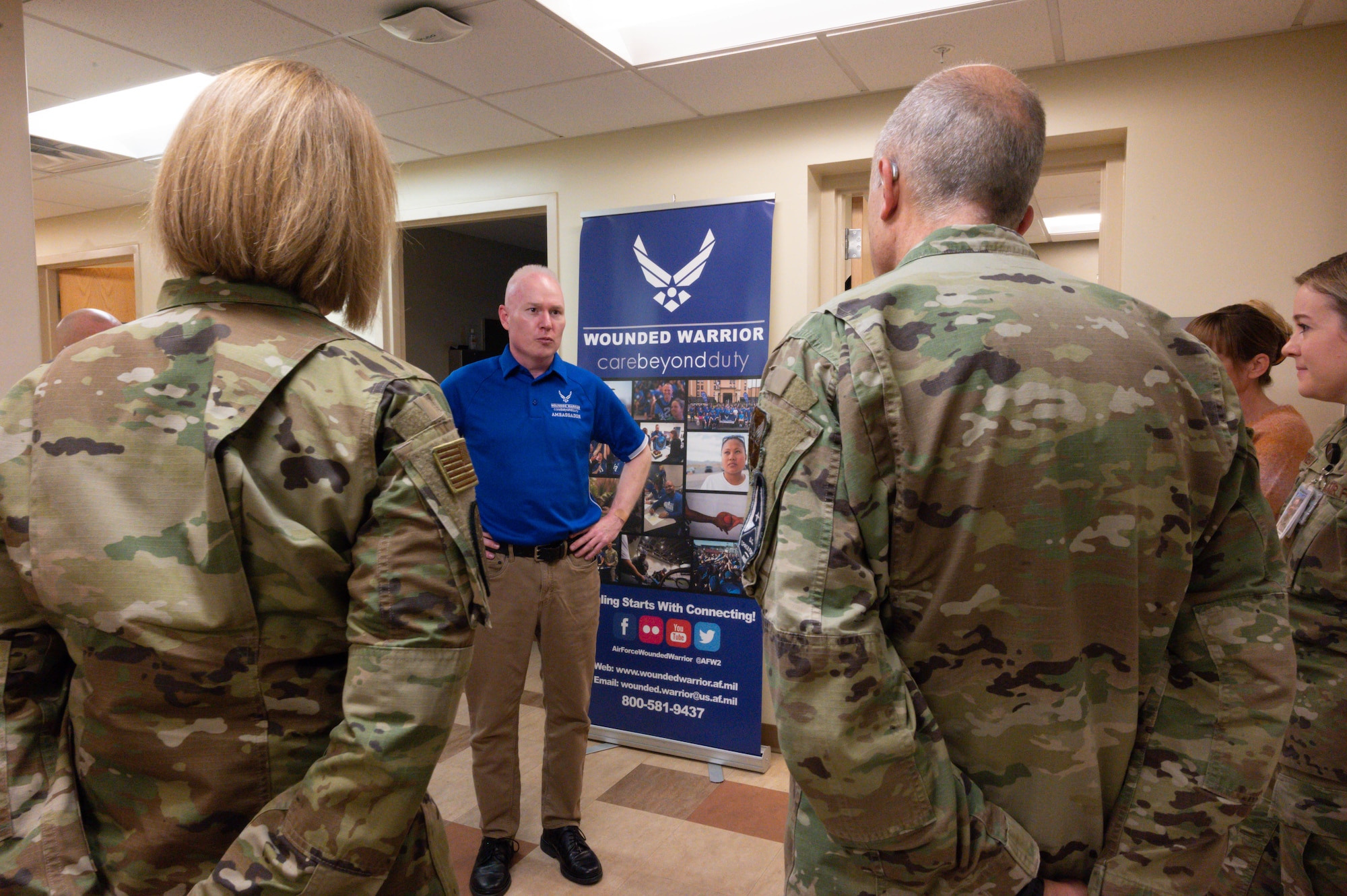 Maj. Stepanek stands while briefing Lt. Gen. Miller and Chief Master Sgt. Kolcynski.