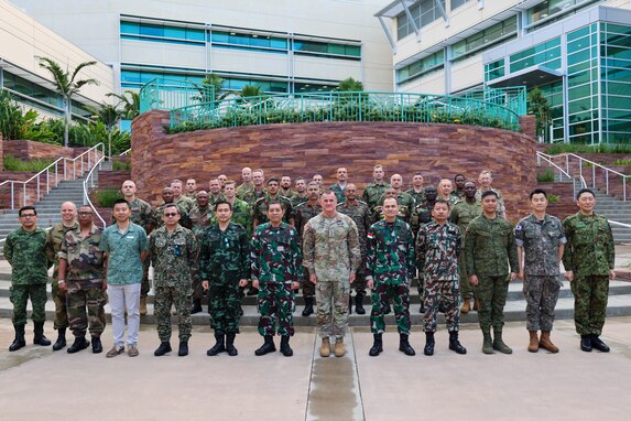 Internation Fellows and U.S. Army Pacific Commanding General Charles A. Flynn stand for a group photo during a visit to the U.S. Army Pacific Headquarters visit on Fort Shafter, HI Feb. 21, 2024. Each year approximately eighty senior military officers from around the world are extended an invitation from the Chief of Staff of the United States Army to attend the United States Army War College. (U.S. Army photo by Spc. Taylor Gray)