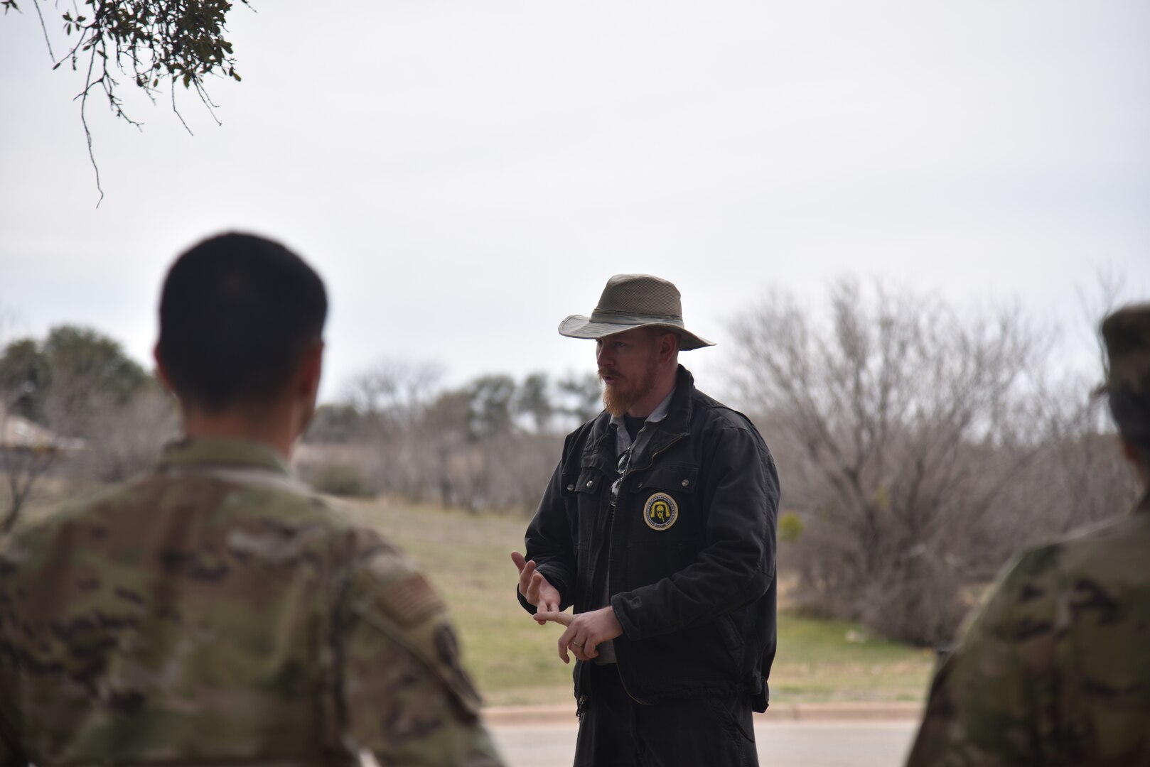 TJ Bocek, master instructor at DECON LLC, briefs 17th Medical Group members before their in-place patient decontamination training at Goodfellow Air Force Base, Texas, Feb. 8, 2024. Decontamination Education and Consulting on Nuclear, Biological, and Chemical training courses provide safety measures for control and containment if a hazardous substance or material is released. (U.S. Air Force photo by Airman James Salellas)