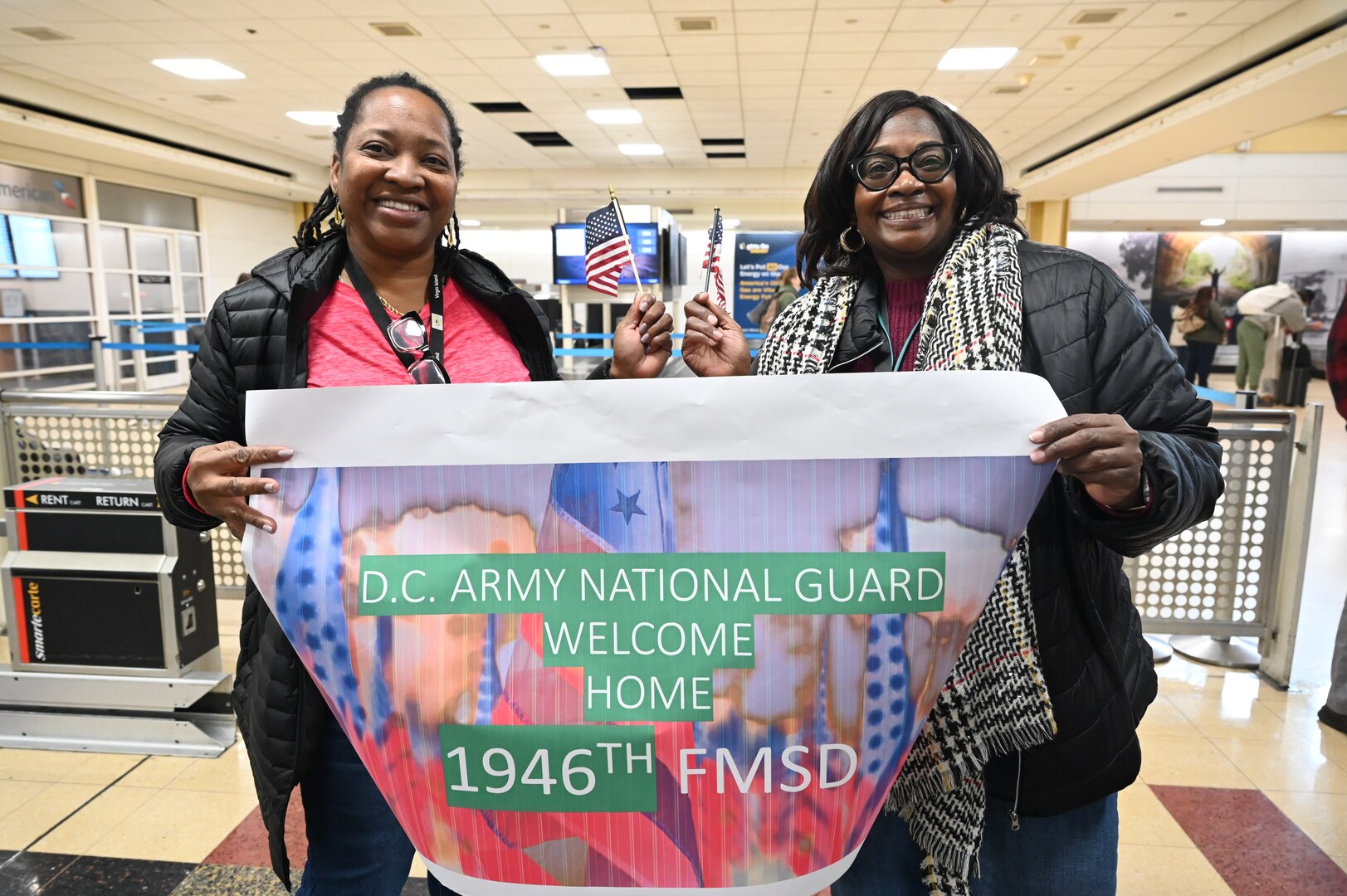 Soldiers with the 1946th Financial Management Support Detachment, District of Columbia National Guard, are greeted by family, friends, senior leadership and D.C. National Guard Family Programs reps at Ronald Reagan Washington National Airport, Feb. 16, 2024. Guard members returned from a nine-month deployment to Camp Bondsteel, Kosovo, providing financial management support to Kosovo Forces assigned to the NATO peacekeeping mission.