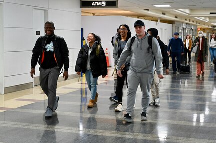 Soldiers with the 1946th Financial Management Support Detachment, District of Columbia National Guard, are greeted by family, friends, senior leadership and D.C. National Guard Family Programs reps at Ronald Reagan Washington National Airport, Feb. 16, 2024. Guard members returned from a nine-month deployment to Camp Bondsteel, Kosovo, providing financial management support to Kosovo Forces assigned to the NATO peacekeeping mission.