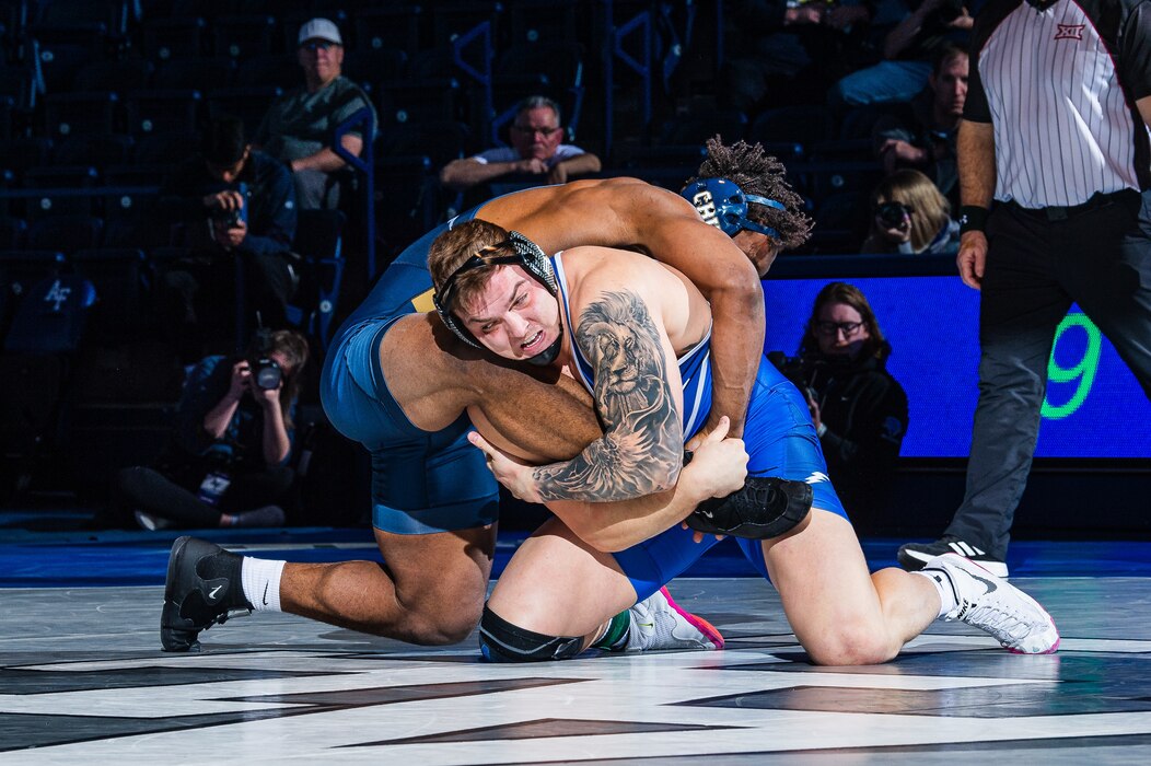 Air Force Academy’s Wyatt Hendrickson completes a takedown during a wrestling match