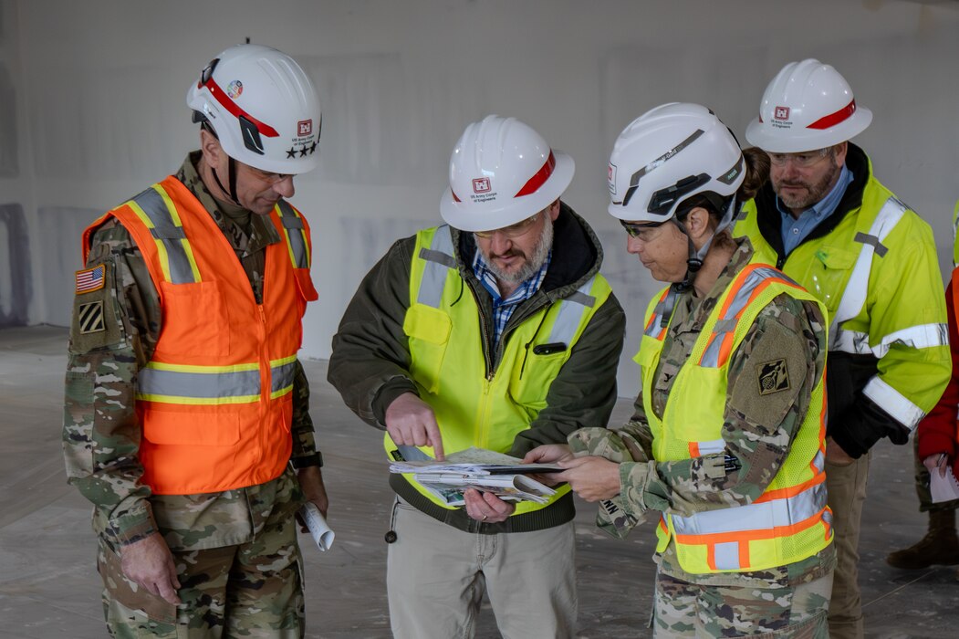Lt. Gen. Scott A. Spellmon, 55th Chief of Engineers and Commanding General of the U.S. Army Corps of Engineers(left), discusses the construction of Fort Campbell Middle School with Col. L. Reyn Mann, Louisville District commander (right) and Hunter Bailey, project engineer, Fort Campbel Resident Office. Construction began February 2021 and is scheduled to be turned over to DoDEA in 2025.