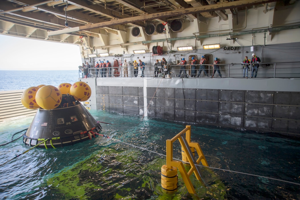 Sailors stabilize NASA's crew module test article aboard USS San Diego (LPD 22) during Underway Recovery Test 11.