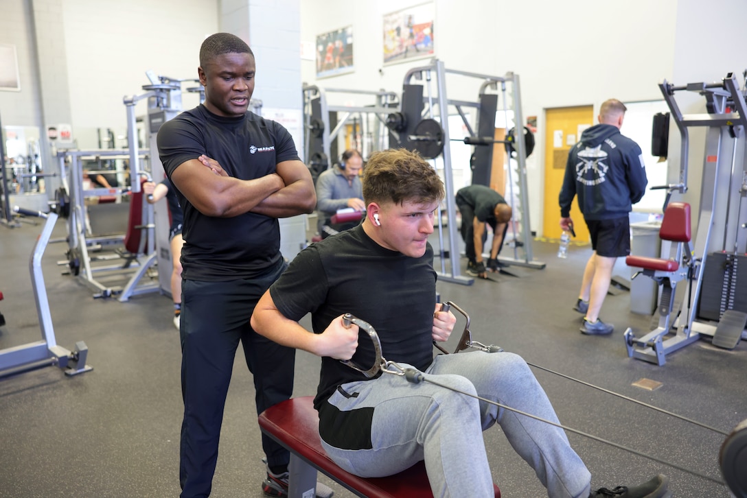 U.S. Marine Corps Sgt. Paul Nhomba, left, mobility chief with the Marine Corps Warfighting Laboratory, sets the example for Pfc. Kaden Maddox, a logistics specialist with MCWL, during a physical training session at the Barber Physical Activity Center, on Marine Corps Base Quantico, Va., Feb. 2, 2024. Nhomba was born and raised in Cameroon; shortly after moving to the U.S., he achieved full citizenship while serving in the U.S. Marine Corps. Nhmoba is described by Maddox as one who “leads by example and won’t ask someone to do anything that he wouldn’t do himself.” (U.S. Marine Corps photo by Sgt. Levi Voss)