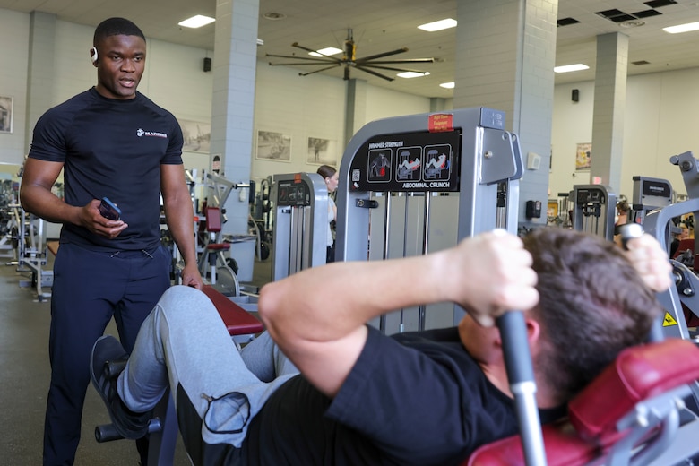 U.S. Marine Corps Sgt. Paul Nhomba, left, mobility chief with the Marine Corps Warfighting Laboratory, sets the example for Pfc. Kaden Maddox, a logistics specialist with MCWL, during a physical training session at the Barber Physical Activity Center, on Marine Corps Base Quantico, Va., Feb. 2, 2024. Nhomba was born and raised in Cameroon; shortly after moving to the U.S., he achieved full citizenship while serving in the U.S. Marine Corps. Nhmoba is described by Maddox as one who “leads by example and won’t ask someone to do anything that he wouldn’t do himself.” (U.S. Marine Corps photo by Sgt. Levi Voss)