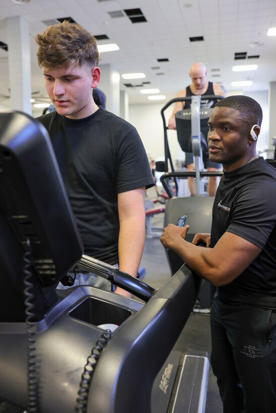 U.S. Marine Corps Sgt. Paul Nhomba, left, mobility chief with the Marine Corps Warfighting Laboratory, sets the example for Pfc. Kaden Maddox, a logistics specialist with MCWL, during a physical training session at the Barber Physical Activity Center, on Marine Corps Base Quantico, Va., Feb. 2, 2024. Nhomba was born and raised in Cameroon; shortly after moving to the U.S., he achieved full citizenship while serving in the U.S. Marine Corps. Nhmoba is described by Maddox as one who “leads by example and won’t ask someone to do anything that he wouldn’t do himself.” (U.S. Marine Corps photo by Sgt. Levi Voss)