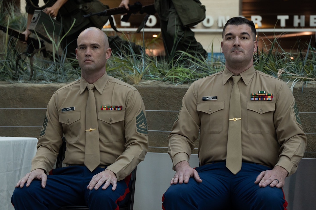 U.S. Marine Corps Gunnery Sgt. Russell B. Cowan, left, a recruiter with Recruiting Station San Diego, Calif., 12th Marine Corps District, and Gunnery Sgt. Tristan Wiggin, right, a recruiter with Recruiting Station Tampa, Fl., 6th Marine Corps District stand by to receive the award for Recruiter of the Year and First Runner-up, respectively, at the National Museum of The Marine Corps, Triangle, Va., February 8, 2024. The award was given to recognize the best of those who scour the nations landscape seeking out those who will take their place upon the yellow footprints. (U.S. Marine Corps photo by Sgt. Rachaelanne Woodward)