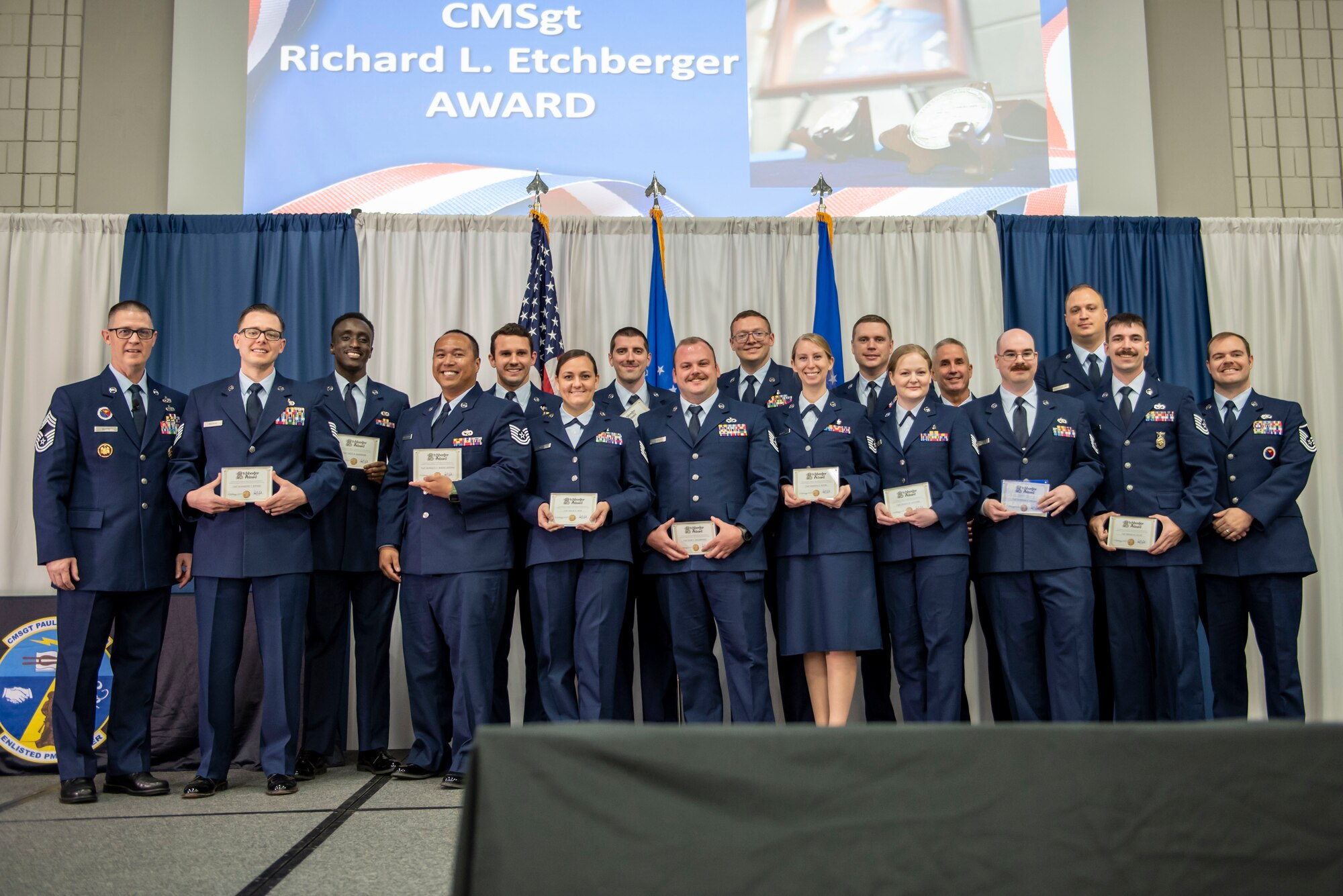 U.S. Air Force Airmen from Non-Commissioned Officers Academy (NCOA) F-Flight receive the Etchberger team Award during NCOA class 24-2 graduation.