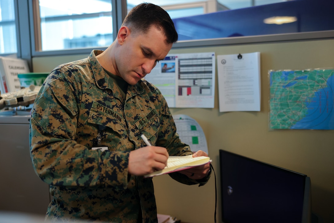 U.S. Marine Corps Gunnery Sgt. Joshua Ostermann, Prior Service Recruiting statistician chief, Marine Corps Recruiting Command and a native of El Cajon, Ca., adds to his to-do list in his office on Marine Corps Base Quantico Feb. 2, 2024. Ostermann’s responsibilities include overseeing statistical research and analysis for PSR, ensuring data accuracy and interpreting complex data for decision-making. (U.S. Marine Corps photo by Lance Cpl. Brenna Ritchie)