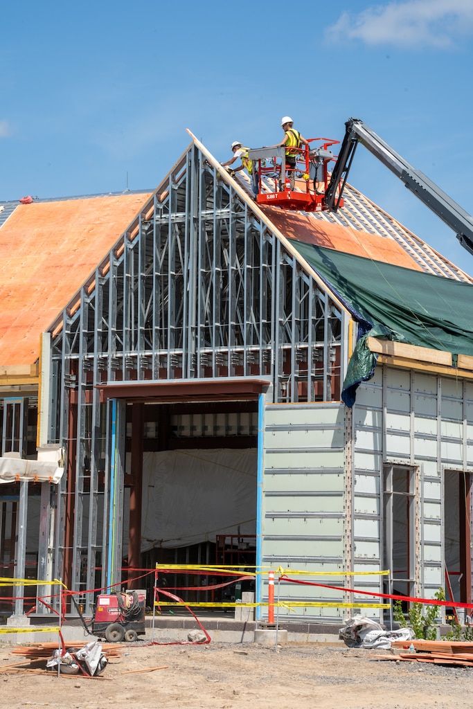 Contractors work on the roof of the Community Center at the Canandaigua VA Medical Center Aug. 22, 2023.