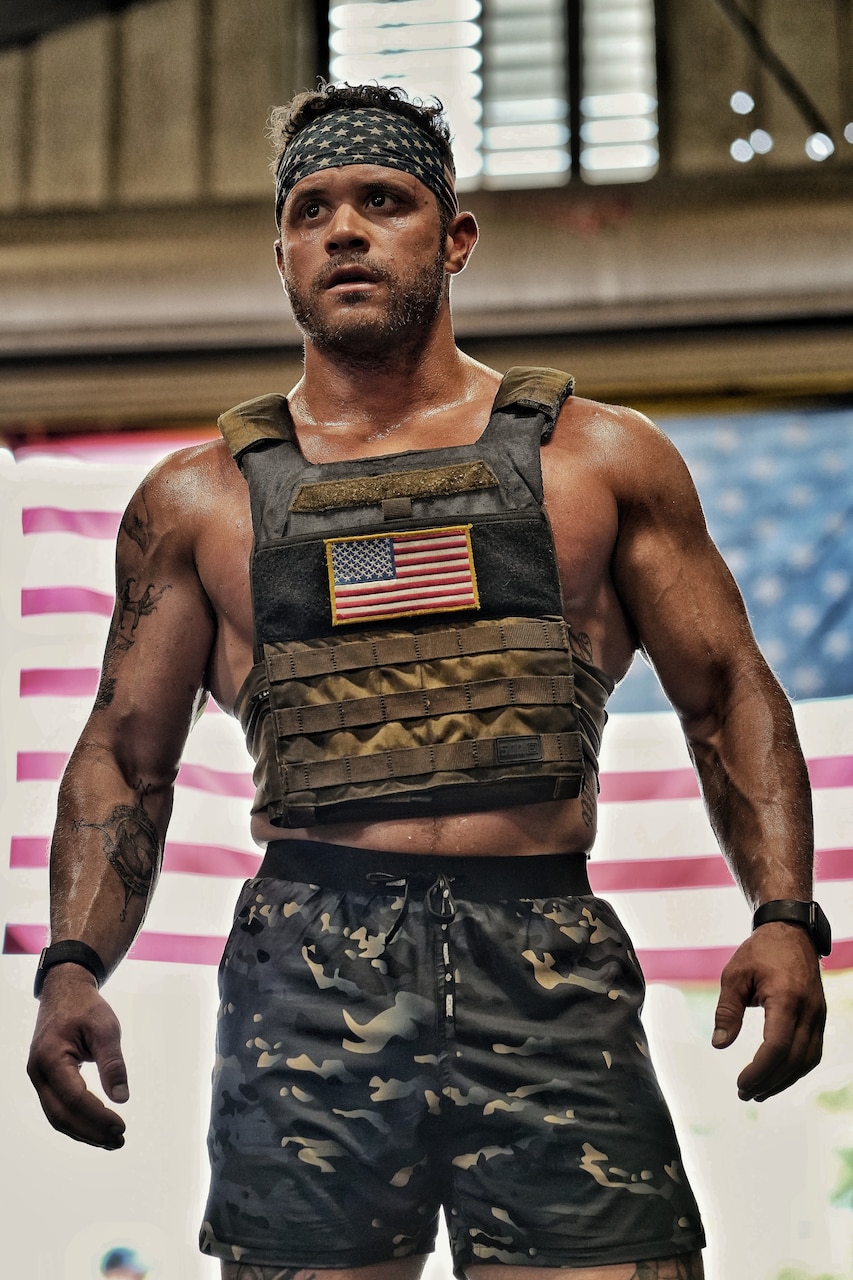 A soldier poses for a photo.