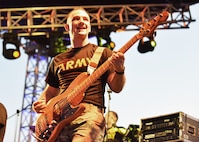 Staff Sgt. Chazz Rogers of the New Hampshire National Guard’s 39th Army Band plays bass guitar during a 39th Army Band performance at the Ilopango air show Feb. 17, 2024, in El Salvador.