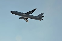 A six-person aircrew from the 157th Air Refueling Wing performs a flyover in a KC-46 Pegasus at the Ilopango air show Feb. 17, 2024, in El Salvador. The 39th Army Band also performed at the show for thousands of attendees. (U.S. Air National Guard photo by Master Sgt. Charles Johnston)