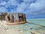 Naval gunfire damage to Japanese storage bunker, Namur Island. Author photo.