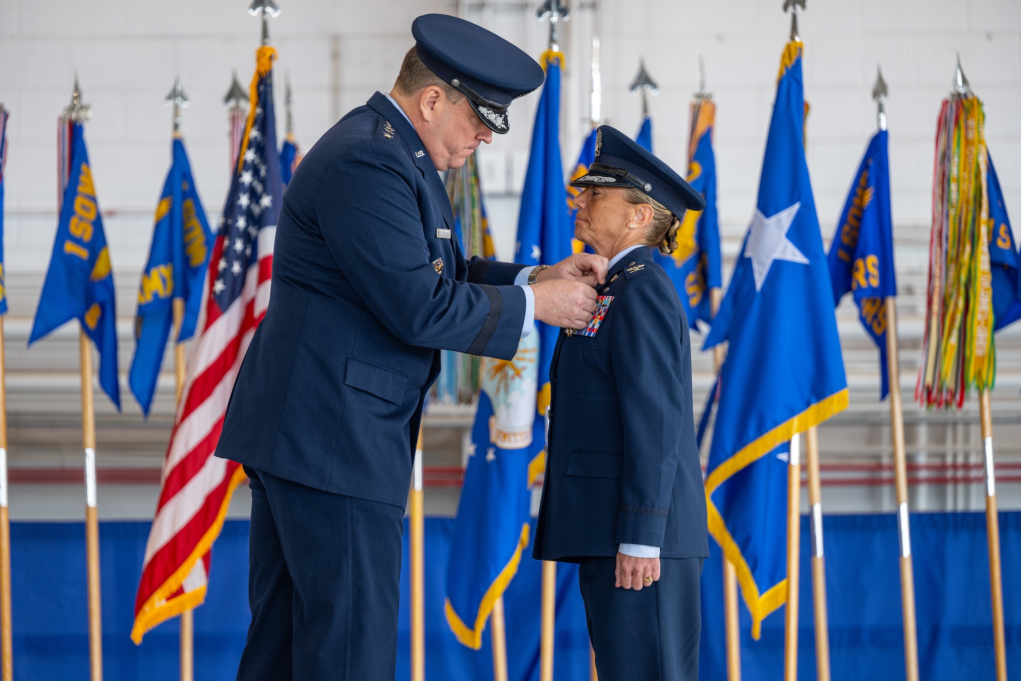 U.S. Air Force Lt. Gen. Tony Bauernfeind, Air Force Special Operations Command commander, left, pins the Legion of Merit medal on Col. Allison Black, 1st Special Operations Wing outgoing commander, during the 1st SOW change of command ceremony at Hurlburt Field, Florida, Feb. 23, 2024.