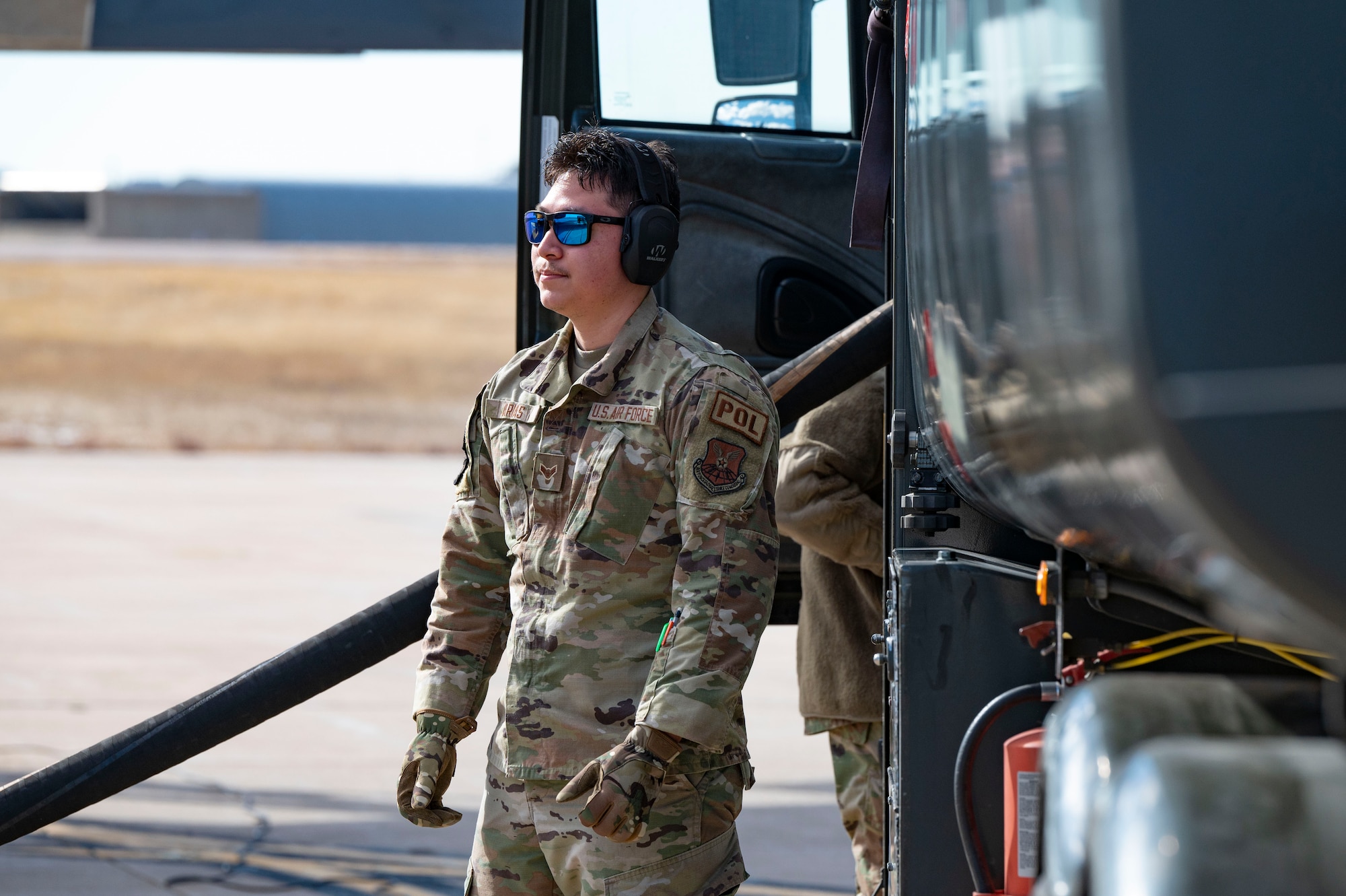 Airman 1st Class Daniel Arias, 7th Logistics Readiness Squadron fuels distribution operator, performs hot pit refueling on a B-1B Lancer at Buckley Space Force Base, Colorado, Feb. 14, 2024. Hot pit refueling enhances the overall agility of combat forces, ensuring they can adapt to evolving threats. (U.S. Air Force Photo by Airman 1st Class Emma Anderson)