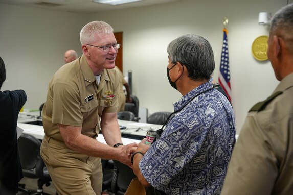 Joint Task Force-Red Hill (JTF-RH) Commander, U.S. Navy Vice Adm. John Wade shakes hands with Manager and Chief engineer of the Board of Water Supply, Ernest Y. W. Lau at the Defueling Information Sharing Forum, Feb. 22, 2024 at the Hawaii State Capitol, Honolulu, Hawaii.