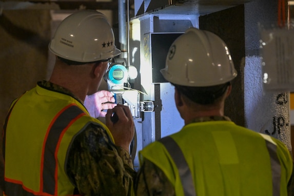 Joint Task Force-Red Hill (JTF-RH) Commander, U.S. Navy Vice Adm. John Wade, views a pressure indicator with Vice Adm. Jeffrey Jablon, Deputy Chief of Naval Operations for Installations and Logistics, during a visit to the Red Hill Bulk Fuel Storage Facility (RHBFSF), Halawa, Hawaii, Feb. 22, 2024.