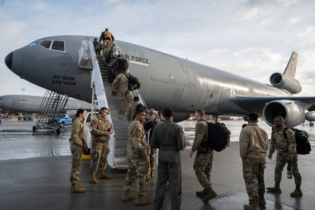 Airmen from Travis Air Force Base, California, board a KC-10 Extender at Travis Air Force Base, California, Feb. 15, 2024.