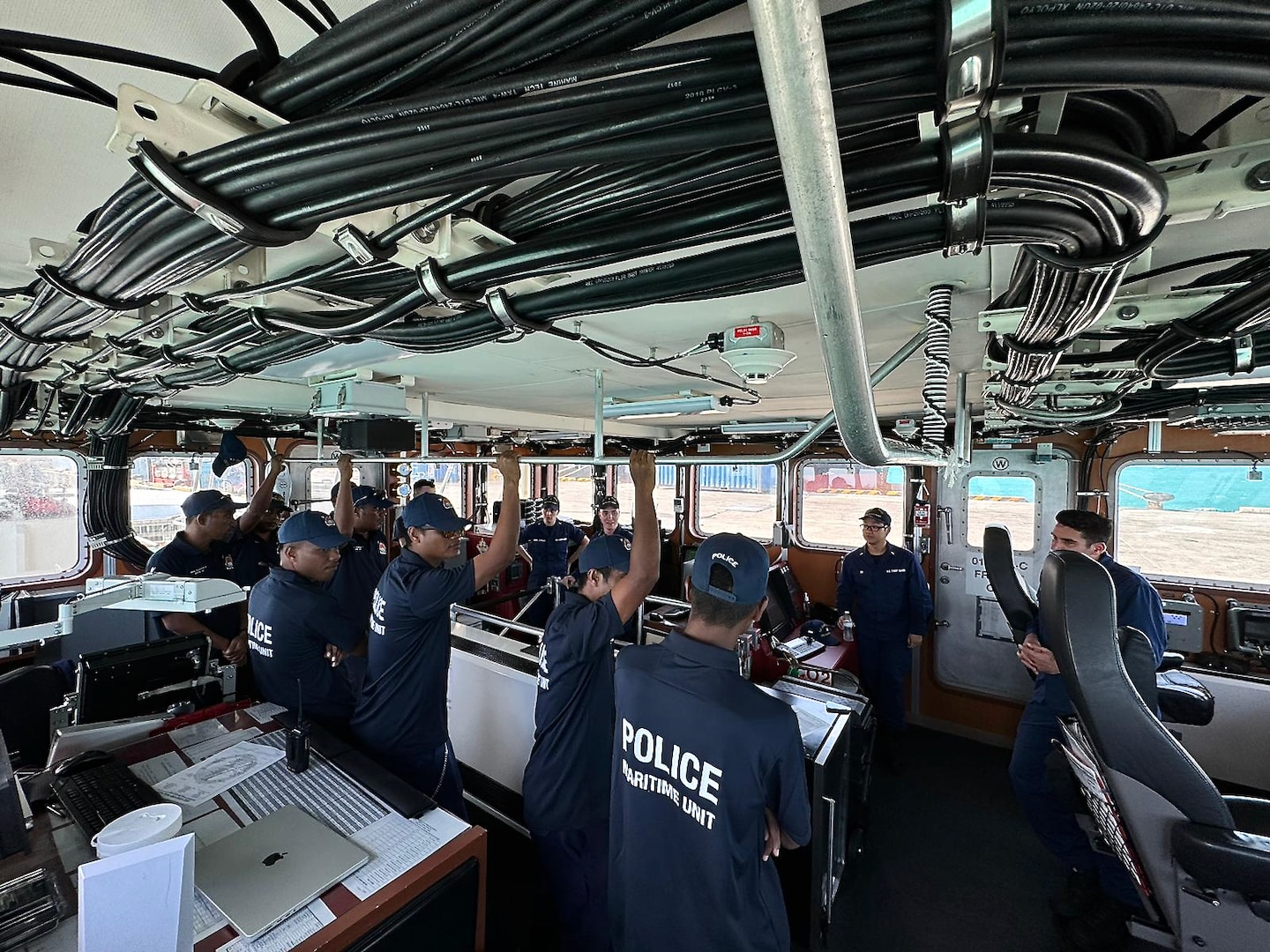 The USCGC Oliver Henry (WPC 1140) crew and shipriders from the Kiribati Police Maritime Unit (PMU) patrol in the Kiribati exclusive economic zone (EEZ) from Feb. 11, 2024. For the first time since 2015, the patrol incorporated shipriders from the PMU, executing the maritime bilateral agreement signed with Kiribati in 2008. These engagements under Operation Blue Pacific emphasize the United States' commitment to strengthening ties and ensuring maritime security within the Pacific community. (U.S Coast Guard photo by Lt. j.g. Nicholas Haas)