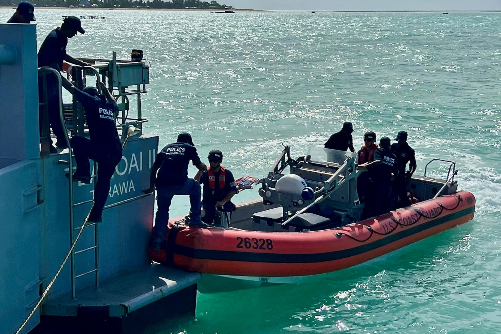 The USCGC Oliver Henry (WPC 1140) crew pick up Kiribati Police Maritime Unit officers and recruits from the Guardian-class patrol boat RKS Teanoai II (301) in Tarawa, Kiribati, on Feb. 16, 2024, during an exchange. For the first time since 2015, the patrol incorporated shipriders from the PMU, executing the maritime bilateral agreement signed with Kiribati in 2008. These engagements under Operation Blue Pacific emphasize the United States' commitment to strengthening ties and ensuring maritime security within the Pacific community. (U.S Coast Guard photo by Lt. j.g. Nicholas Haas)