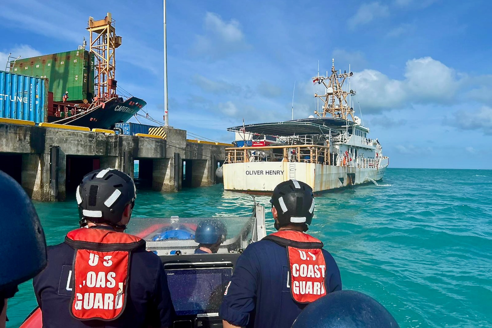 The USCGC Oliver Henry (WPC 1140) crew approach Betio Wharf in Tarawa, Kiribati, on Feb. 16, 2024, during an exchange with the Kiribati Police Maritime Unit officers and recruits. For the first time since 2015, the patrol incorporated shipriders from the PMU, executing the maritime bilateral agreement signed with Kiribati in 2008. These engagements under Operation Blue Pacific emphasize the United States' commitment to strengthening ties and ensuring maritime security within the Pacific community. (U.S Coast Guard photo by Lt. j.g. Nicholas Haas)