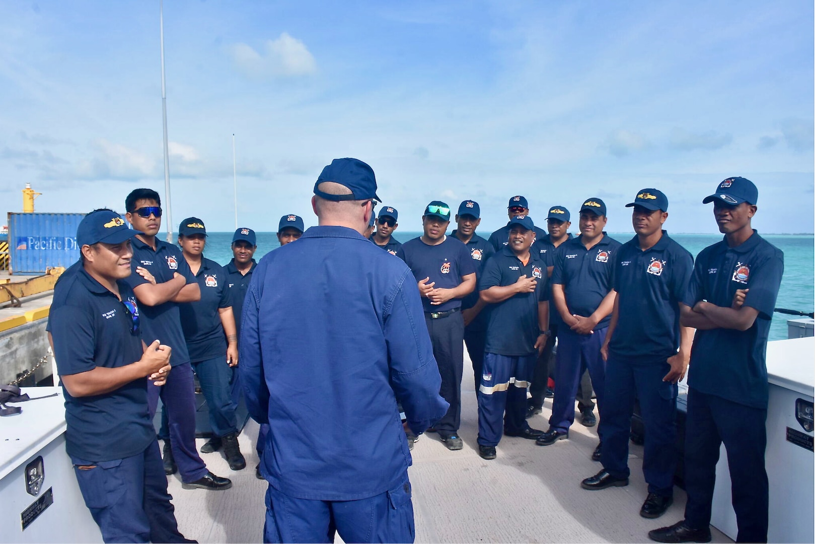 Lt. Stephen Mueller of the International Maritime Training Team addresses Kiribati Police Maritime Unit officers and recruits aboard the USCGC Oliver Henry (WPC 1140) in Tarawa, Kiribati, on Feb. 16, 2024. For the first time since 2015, the patrol incorporated shipriders from the PMU, executing the maritime bilateral agreement signed with Kiribati in 2008. These engagements under Operation Blue Pacific emphasize the United States' commitment to strengthening ties and ensuring maritime security within the Pacific community. (U.S Coast Guard photo by Lt. j.g. Nicholas Haas)