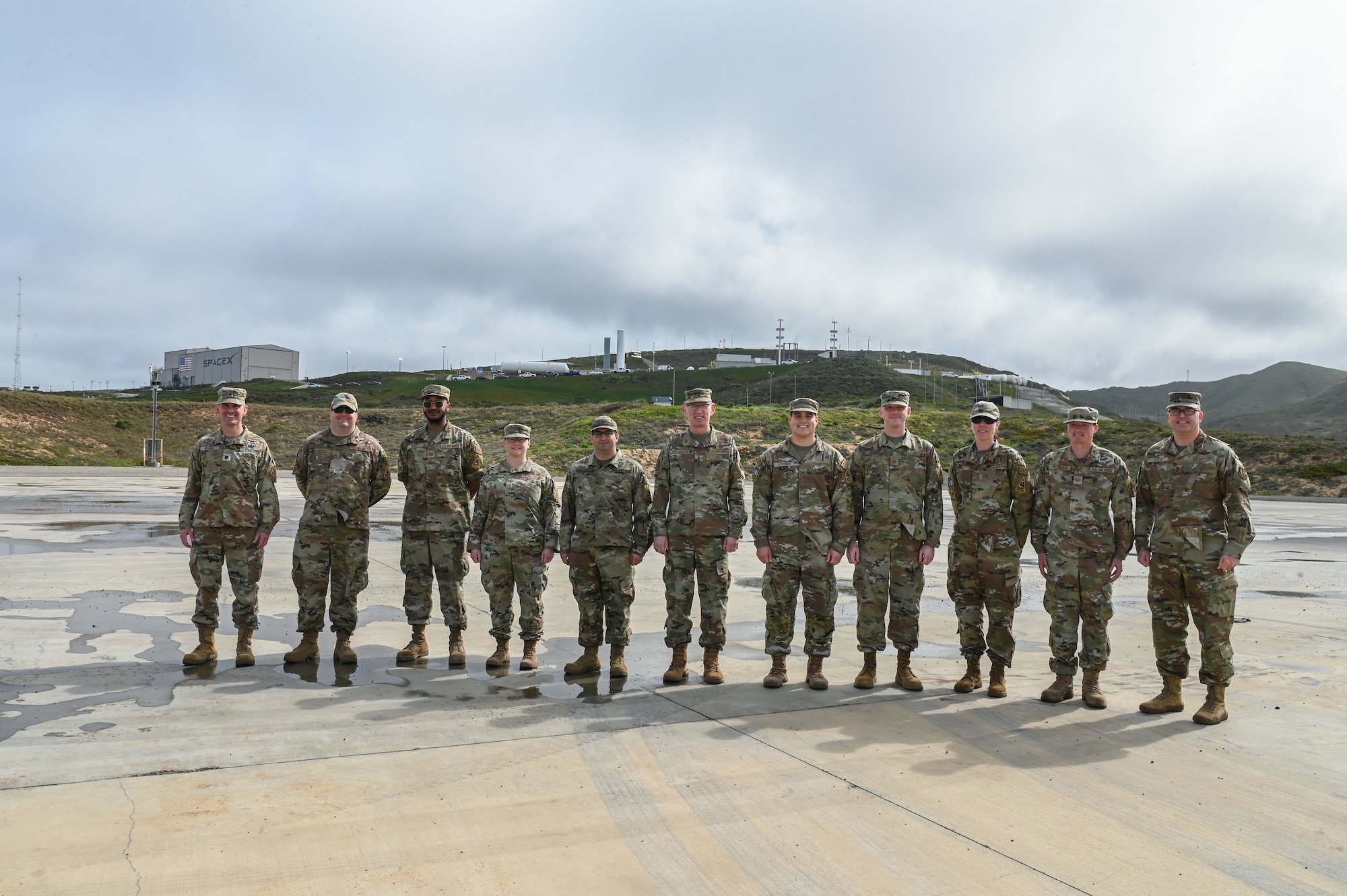 Air Force Materiel Command commander, poses for a photo with the U.S. Air Force mission assurance technicians assigned to the 2nd Space Launch Squadron on Space Launch Complex 4 East during a tour at Vandenberg Space Force Base.