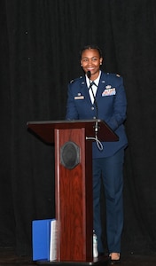 U.S. Air Force Maj. Aisha Lockett, 97th Force Support Squadron (FSS) commander, smiles during a change of command ceremony at Altus Air Force Base (AFB), Oklahoma, July 10, 2023. The 97th FSS is comprised of ten flights which support the training, airlift and refueling missions of the 97th Air Mobility Wing by providing premier manpower, civilian personnel, military personnel, lodging, dining, education, professional development, library, family support, childcare and leisure services. (U.S. Air Force photo by Airman 1st Class Miyah Gray)