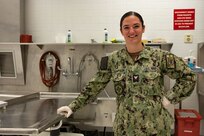 NAVAL STATION ROTA, Spain (September 9, 2023) Hospital Corpsman 2nd Class Julianne Thompson,  a Navy mortician assigned to Navy and Marine Corps Mortuary Detachment Rota, Spain, poses for a photo September 9, 2023. As the "Gateway to the Mediterranean,” NAVSTA Rota provides U.S, NATO and allied forces a strategic hub for operations in Europe, Africa and the Middle East. NAVSTA Rota is a force multiplier, capable of promptly deploying and supporting combat-ready forces through land, air and sea, enabling warfighters and their families, sustaining the fleet and fostering the U.S. and Spanish partnership. (U.S. Navy photo by Mass Communication Specialist 2nd Class Drace Wilson)