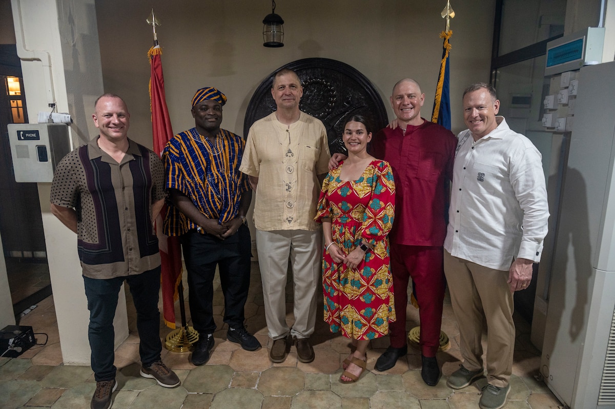 From left, Command Sgt. Maj. Eric Binstock, North Dakota Army National Guard state command sergeant major; 2nd Lt. Denis Duku, 426th Signal Company; Maj. Gen. Al Dohrmann, adjutant general; Maj. Beth Simek, North Dakota bilateral affairs officer for Ghana; Lt. Col. Jarrod Simek, U.S. Special Operations Command Africa, and Lt. Col. Mark McEvers take a photo at the 20th-anniversary celebration of North Dakota and the Republic of Ghana's partnership in the State Partnership Program, Feb. 22, 2024, in Accra, Ghana. North Dakota and Ghana are one of 18 partnerships in Africa.