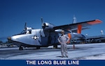 A March 1959 color photo of LTJG Bobby Wilks posing in front of an HU-16E “Albatross” fixed-wing amphibian aircraft. (U.S. Coast Guard)