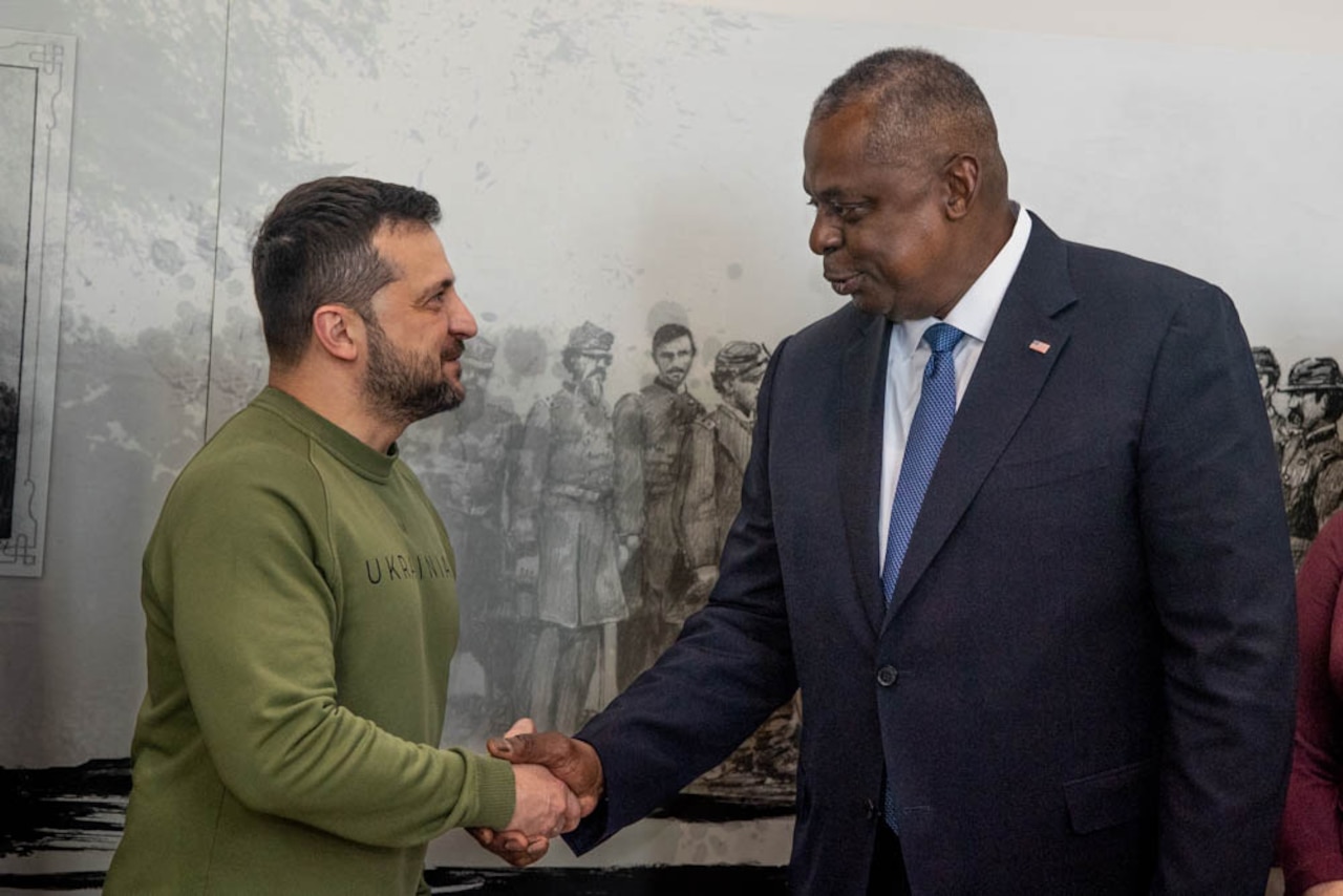 Secretary of Defense Lloyd J. Austin III shakes hands with the Ukrainian president.