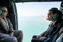 FAILAKA, Kuwait (Feb. 5, 2024) Marine Brig. Gen. Matthew Reid, commanding general of Task Force 51/5th Marine Expeditionary Brigade, left, and U.S. Ambassador to Kuwait Karen H. Sasahara, fly in a UH-60 Blackhawk helicopter while on a tour of the training areas during exercise Eager Defender 24 at Failaka, Kuwait, Feb. 5. Eager Defender 24 is the capstone in a series of bilateral exercises between Kuwait and U.S. naval forces, focused on enhancing mutual capabilities and interoperability in maritime security operations. (U.S. Marine Corps photo)