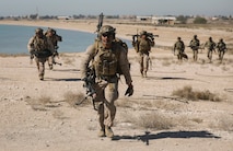 240206-M-IU565-1194 FAILAKA ISLAND, Kuwait (Feb. 6, 2024) Marines assigned to Fleet Anti-Terrorism Security Team Central Command conduct a patrol while participating in the final evolution of exercise Eager Defender 24 on Failaka Island, Kuwait, Feb. 6. Eager Defender 24 is the capstone in a series of bilateral exercises between Kuwait and U.S. naval forces, focused on enhancing mutual capabilities and interoperability in maritime security operations. (U.S. Marine Corps photo)