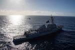 An MH-60S Sea Hawk, attached to the "Tridents" of Helicopter Sea Combat Squadron (HSC) 9, flies near the Arleigh Burke guided-missile destroyer USS Bulkeley (DDG 84) in the Mediterranean Sea. (U.S. Navy photo by Mass Communication Specialist 2nd Class Jacob Mattingly)