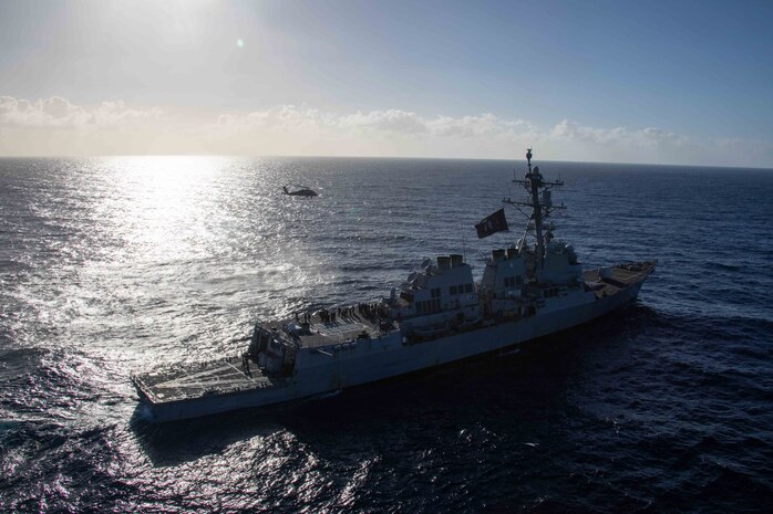 An MH-60S Sea Hawk, attached to the "Tridents" of Helicopter Sea Combat Squadron (HSC) 9, flies near the Arleigh Burke guided-missile destroyer USS Bulkeley (DDG 84) in the Mediterranean Sea. (U.S. Navy photo by Mass Communication Specialist 2nd Class Jacob Mattingly)