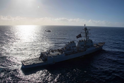 An MH-60S Sea Hawk, attached to the "Tridents" of Helicopter Sea Combat Squadron (HSC) 9, flies near the Arleigh Burke guided-missile destroyer USS Bulkeley (DDG 84) in the Mediterranean Sea. (U.S. Navy photo by Mass Communication Specialist 2nd Class Jacob Mattingly)