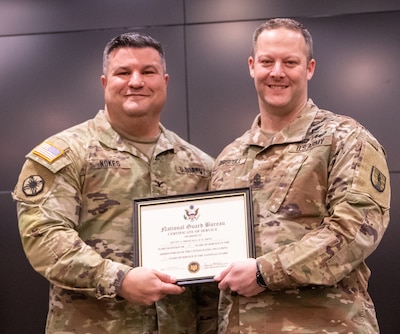 Sgt. Maj. Kevin Driscoll, of Oswego, Illinois, 129th Regiment (Regional Training Institute) operations sergeant major, thanks family and friends for many years of support during his 26 years of military service during a retirement ceremony Feb. 24 at the Illinois Military Academy, Camp Lincoln, Springfield, Illinois.