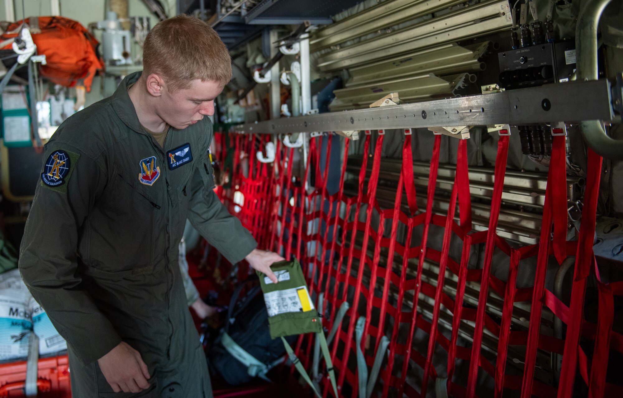 A crew member checks a C-130