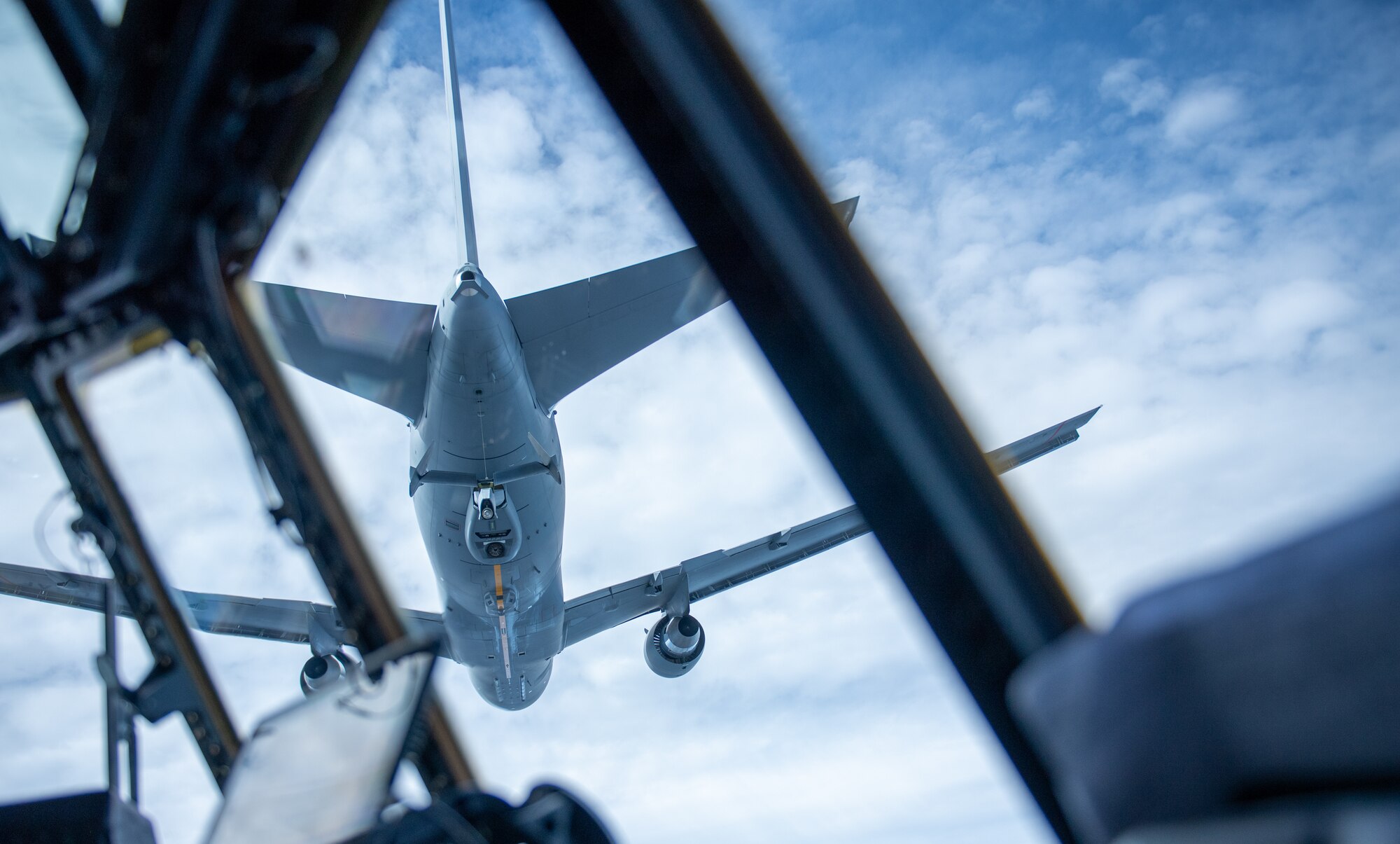 A C-130 flys over
