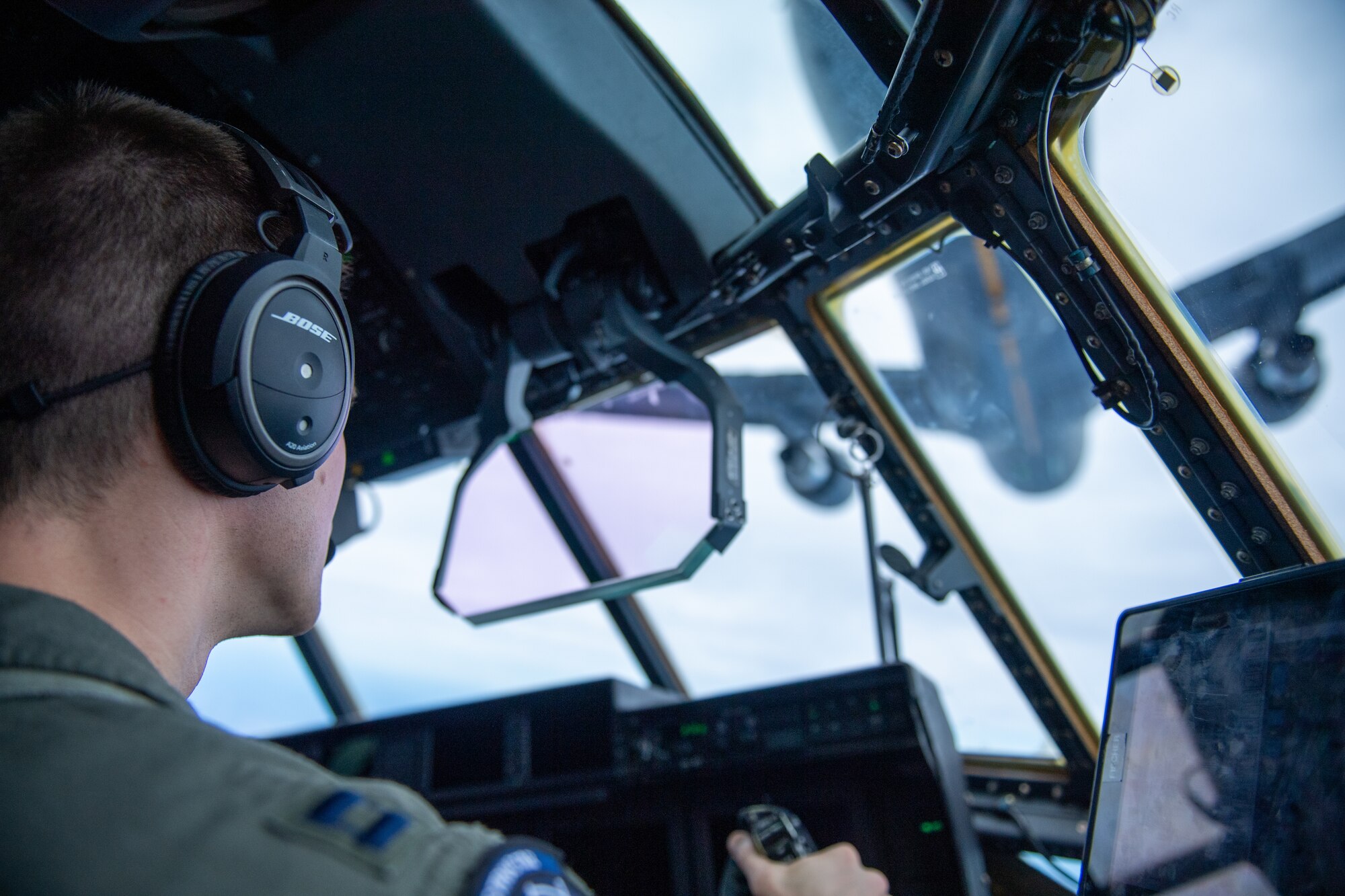 A pilot flys a C-130