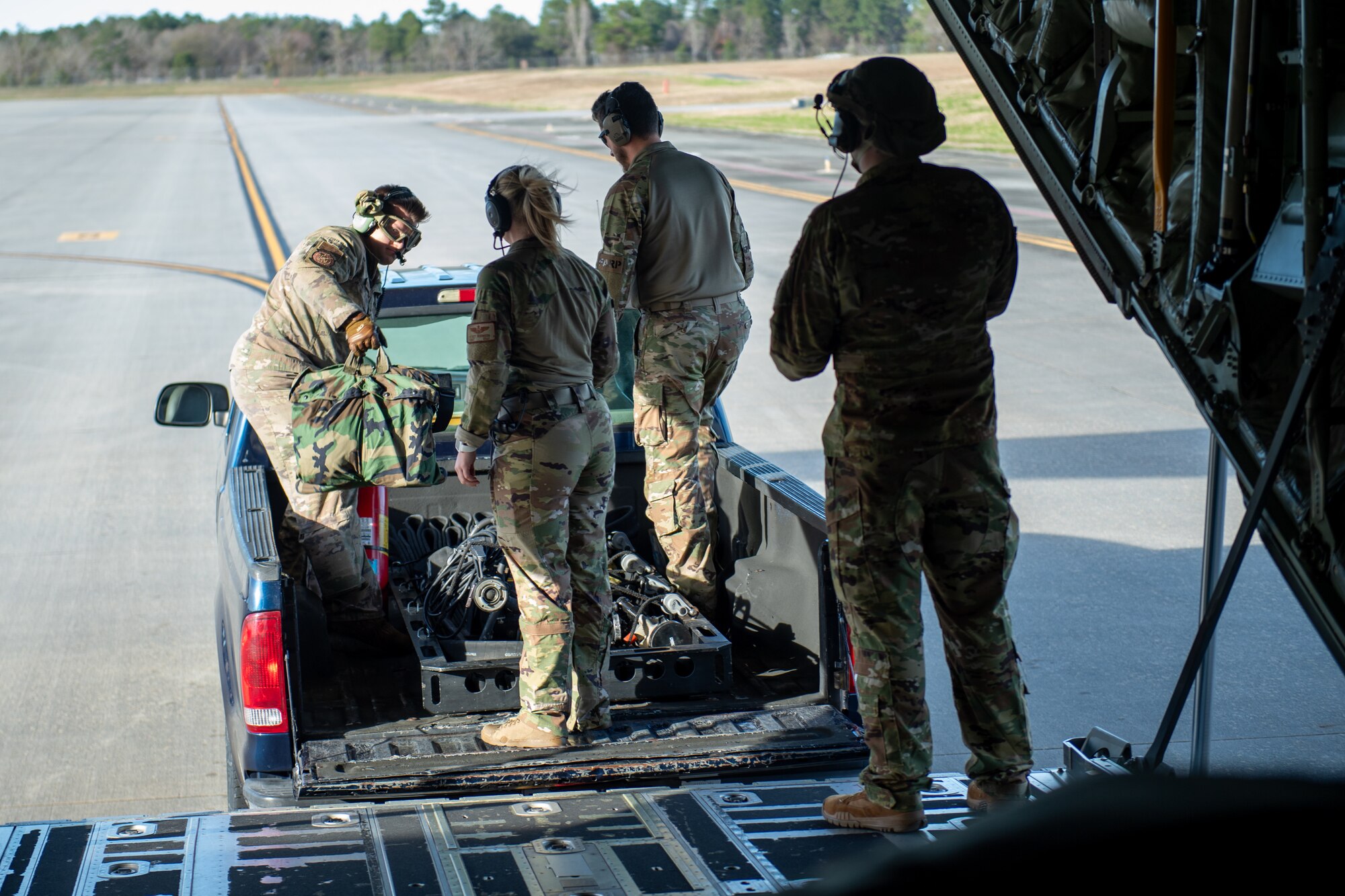 Airmen load a C-130