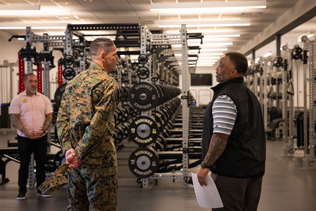 U.S. Marine Corps Sgt. Maj. Carlos A. Ruiz, left, Sergeant Major of the Marine Corps, speaks with Raymond E. Anderson, director of strength and conditioning with Marine Corps Community Services, in the future Warrior Athlete Readiness and Resilience Center, currently under construction, on Marine Corps Base Camp Lejeune, North Carolina, Feb. 22, 2024. This facility will house a holistic, collaborative program that will enhance combat readiness in conjunction with warfighter resiliency by strengthening the mental, social, spiritual, and physical fitness necessary to overcome any challenge. (U.S. Marine Corps photo by Lance Cpl. Loriann Dauscher)