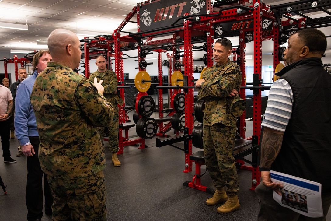 U.S. Marine Corps Sgt. Maj. Carlos A. Ruiz, center right, Sergeant Major of the Marine Corps, speaks to Sgt. Maj. Ryan A. Gnecco, left, sergeant major, Marine Corps Installations East-Marine Corps Base (MCB) Camp Lejeune, in the future Warrior Athlete Readiness and Resilience Center, currently under construction, on MCB Camp Lejeune, North Carolina, Feb. 22, 2024. This facility will house a holistic, collaborative program that will enhance combat readiness in conjunction with warfighter resiliency by strengthening the mental, social, spiritual, and physical fitness necessary to overcome any challenge. (U.S. Marine Corps photo by Lance Cpl. Loriann Dauscher)