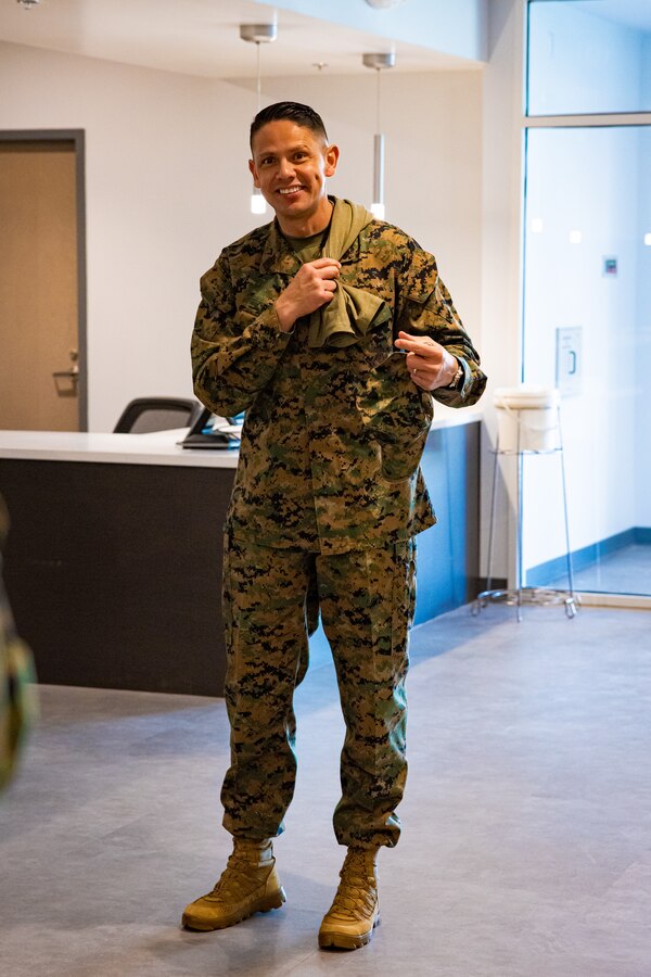 U.S. Marine Corps Sgt. Maj. Carlos A. Ruiz, Sergeant Major of the Marine Corps, holds a shirt given to him in the future Warrior Athlete Readiness and Resilience Center, currently under construction, on Marine Corps Base Camp Lejeune, North Carolina, Feb. 22, 2024. This facility will house a holistic, collaborative program that will enhance combat readiness in conjunction with warfighter resiliency by strengthening the mental, social, spiritual, and physical fitness necessary to overcome any challenge. (U.S. Marine Corps photo by Lance Cpl. Loriann Dauscher)