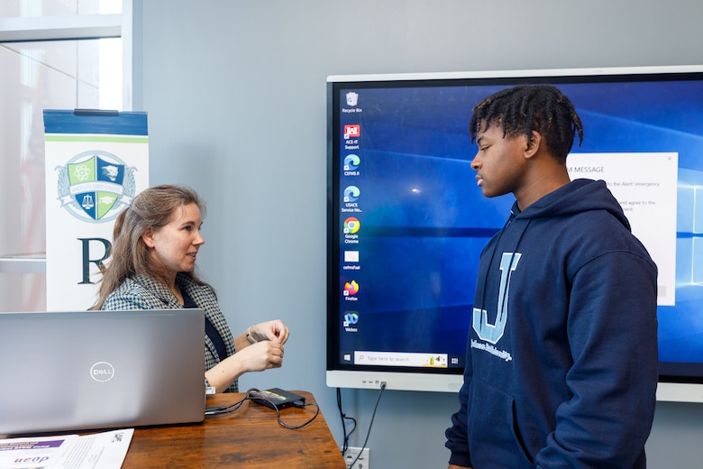 Lauren Dunkin, chief of the Coastal and Hydraulics Laboratory’s (CHL) Coastal Engineering Branch, talks to Leandrew Drake, a student at River City Early College, about STEM opportunities for high school students at ERDC.